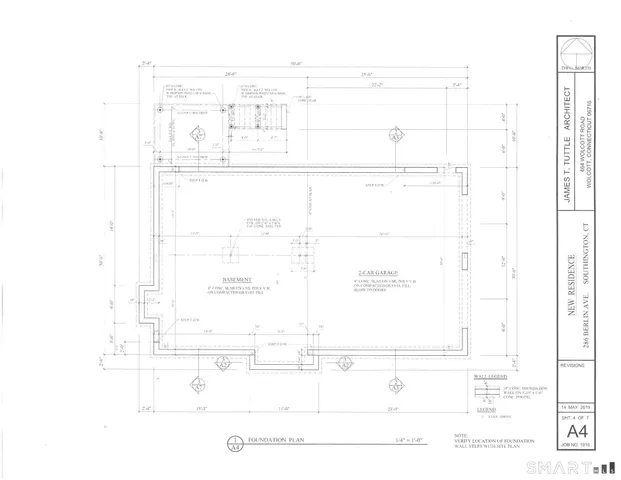 a picture of a room with a white wall and chair