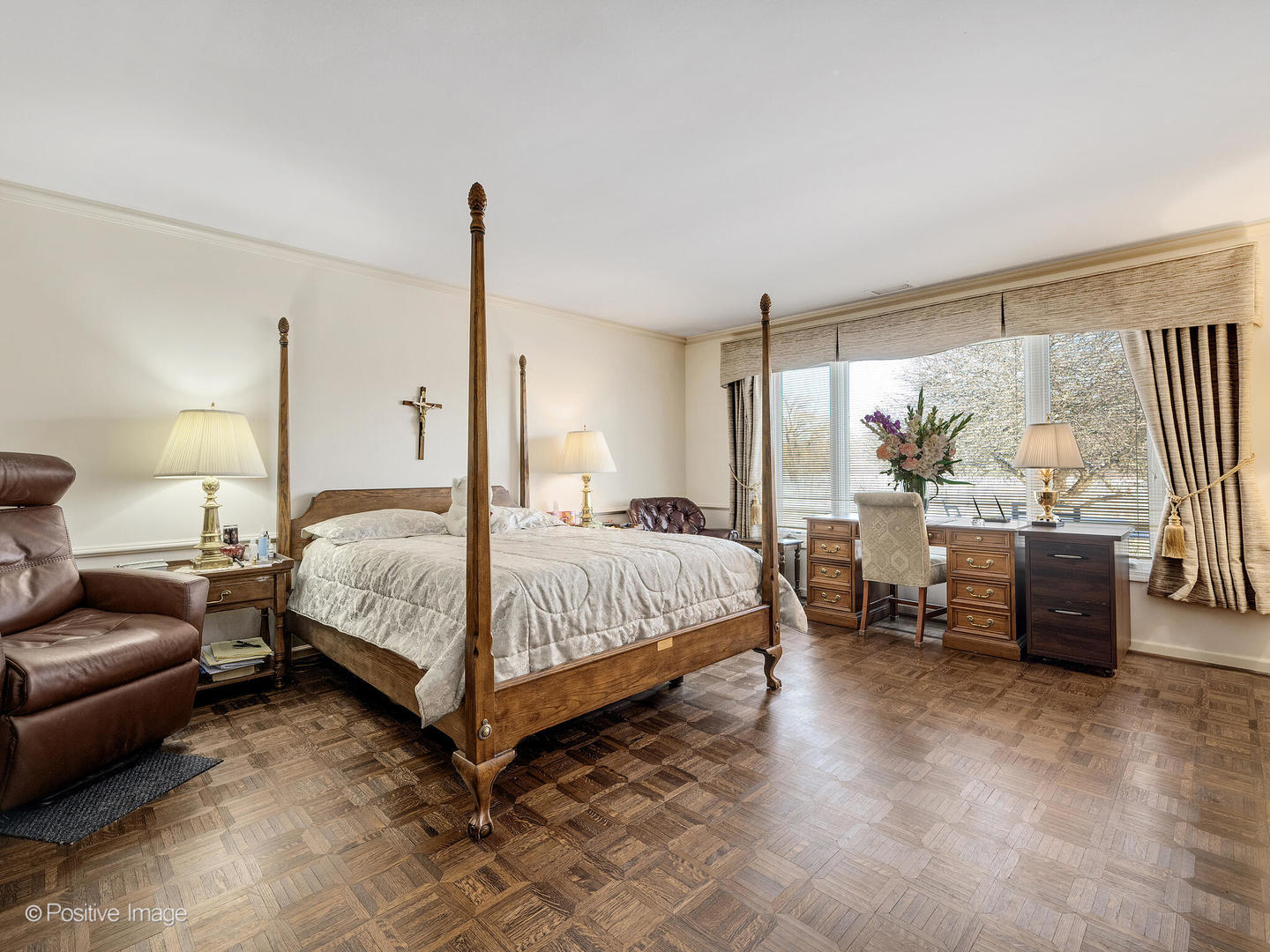 116 Rivershire Lane Lincolnshire, IL 60069 - Photo 15 of 27 a bedroom with a large bed and a large window