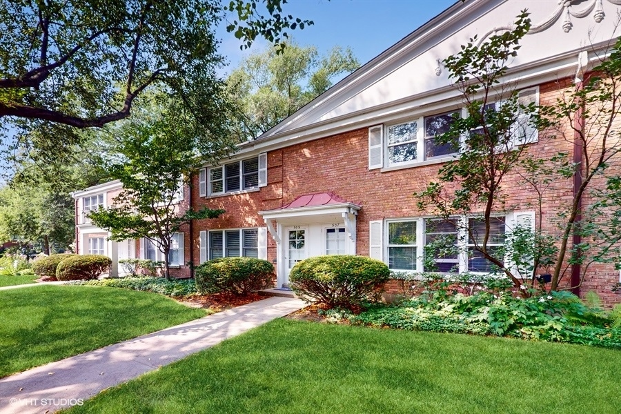 505 3rd Street Wilmette, IL 60091 - Photo 1 of 30 a front view of a house with a garden and plants