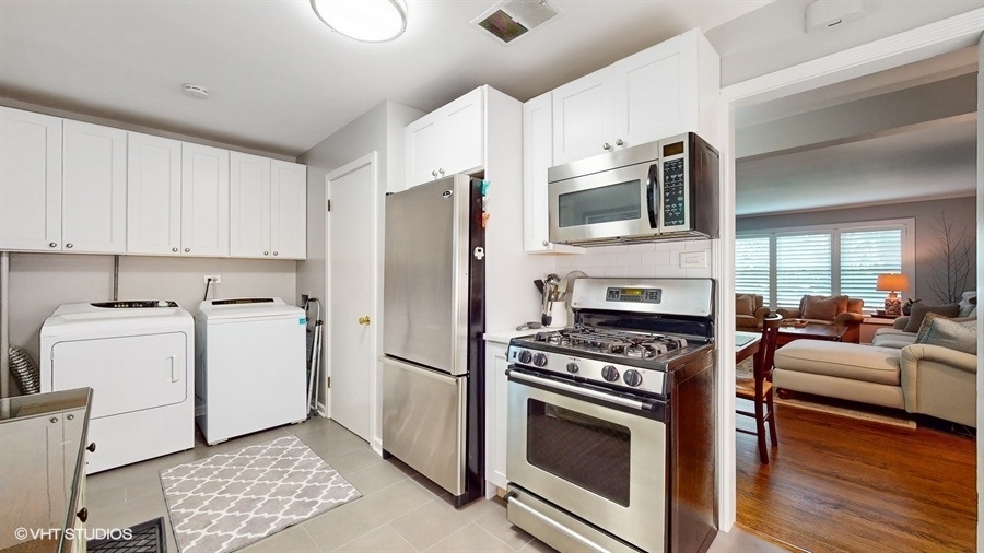 505 3rd Street Wilmette, IL 60091 - Photo 12 of 30 a kitchen with a stove a sink and a refrigerator