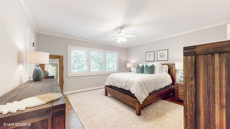 505 3rd Street Wilmette, IL 60091 - Photo 15 of 30 a spacious bedroom with a bed and wooden floor