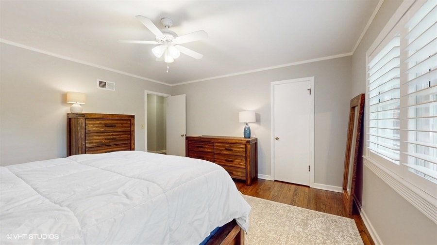 505 3rd Street Wilmette, IL 60091 - Photo 16 of 30 a bedroom with a bed and a ceiling fan