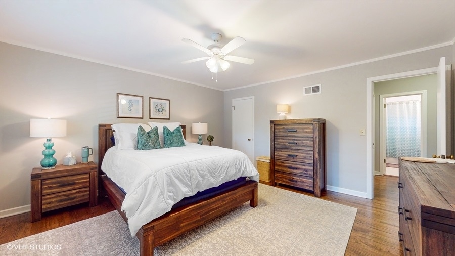 505 3rd Street Wilmette, IL 60091 - Photo 17 of 30 a bedroom with a bed and a chandelier