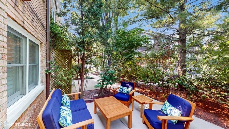 505 3rd Street Wilmette, IL 60091 - Photo 23 of 30 a view of a chairs and table in backyard