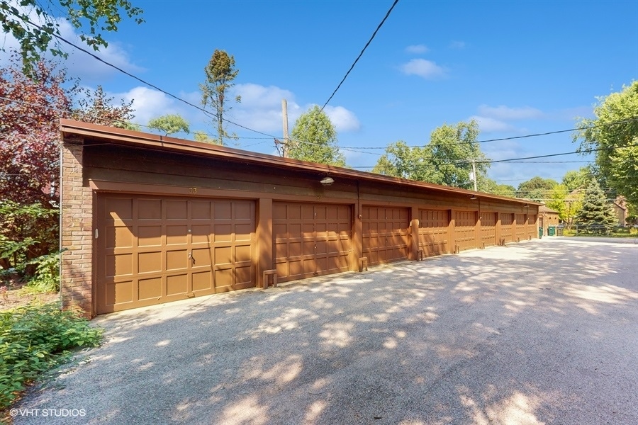 505 3rd Street Wilmette, IL 60091 - Photo 26 of 30 a front view of a house with a yard and garage