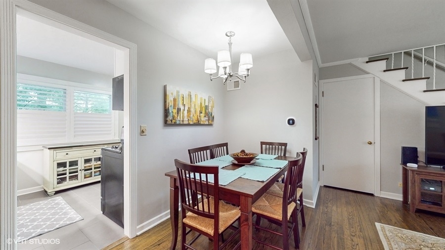 505 3rd Street Wilmette, IL 60091 - Photo 7 of 30 a view of a dining room with furniture and chandelier