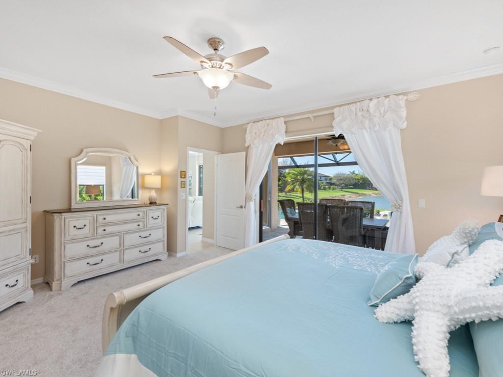 3913 Sapphire Way Naples, FL 34114 - Photo 12 of 32 a bedroom with a bed and a mirror on dresser
