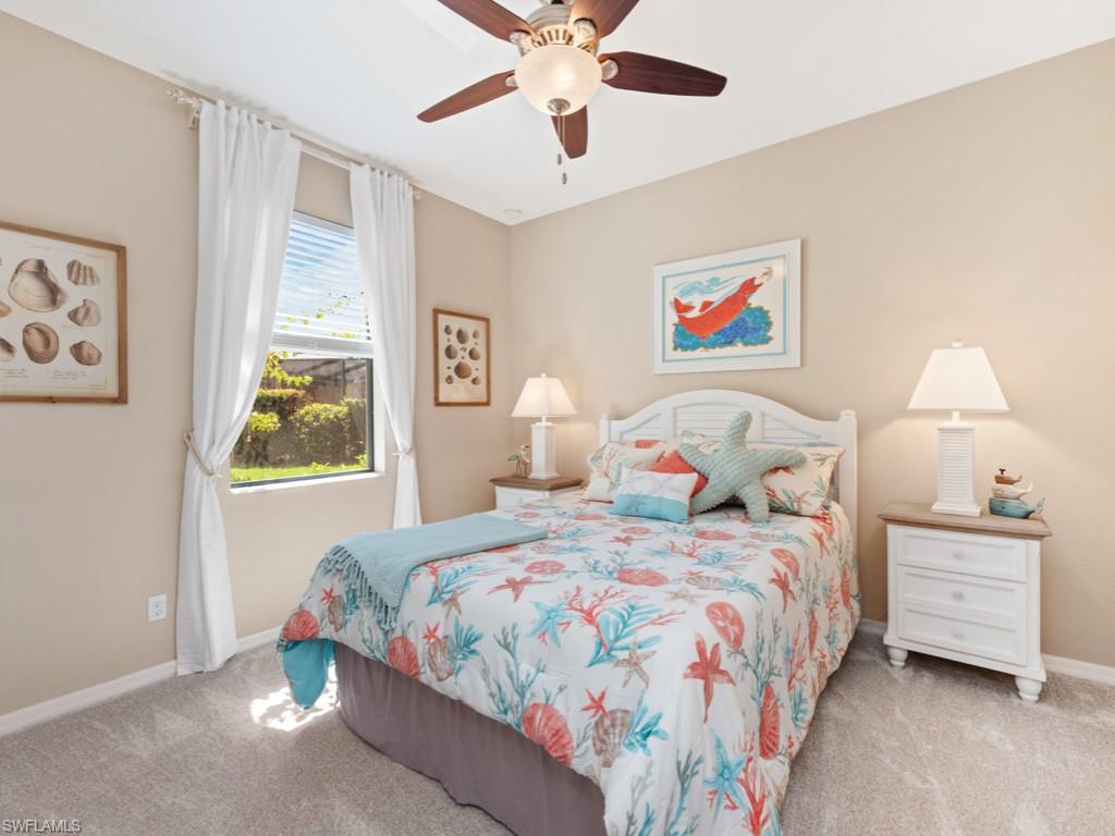3913 Sapphire Way Naples, FL 34114 - Photo 17 of 32 a bedroom with bed and window