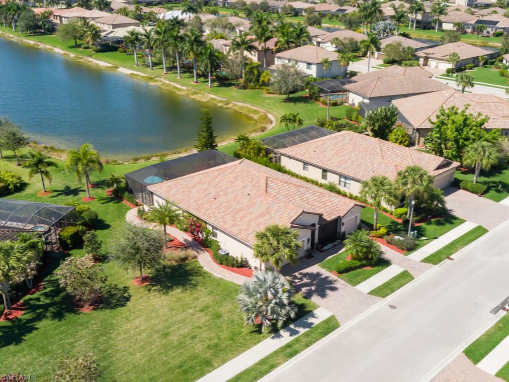 3913 Sapphire Way Naples, FL 34114 - Photo 23 of 32 an aerial view of a house with a garden and lake view