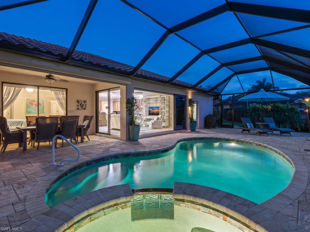 3913 Sapphire Way Naples, FL 34114 - Photo 26 of 32 a view of a swimming pool with outdoor seating