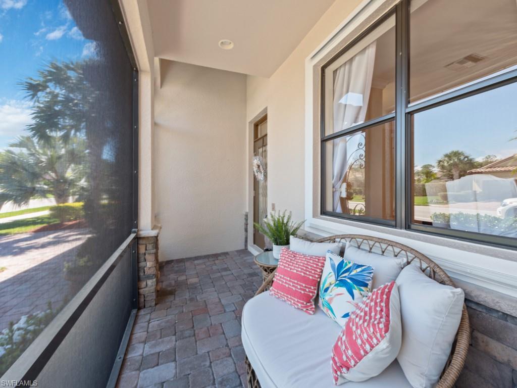 3913 Sapphire Way Naples, FL 34114 - Photo 3 of 32 a living room with furniture and a large window