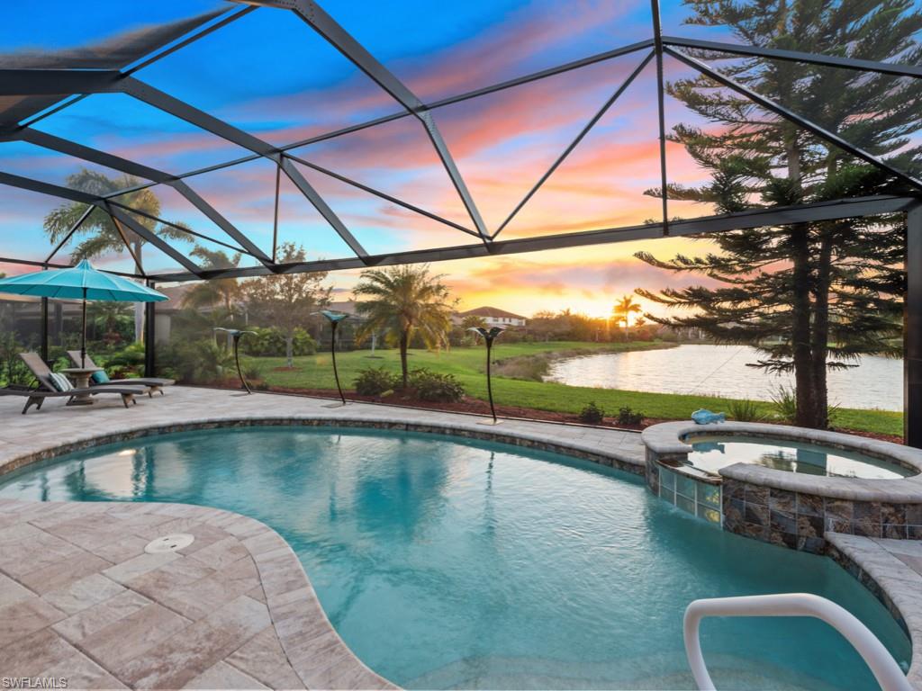 3913 Sapphire Way Naples, FL 34114 - Photo 31 of 32 a view of a swimming pool with a patio