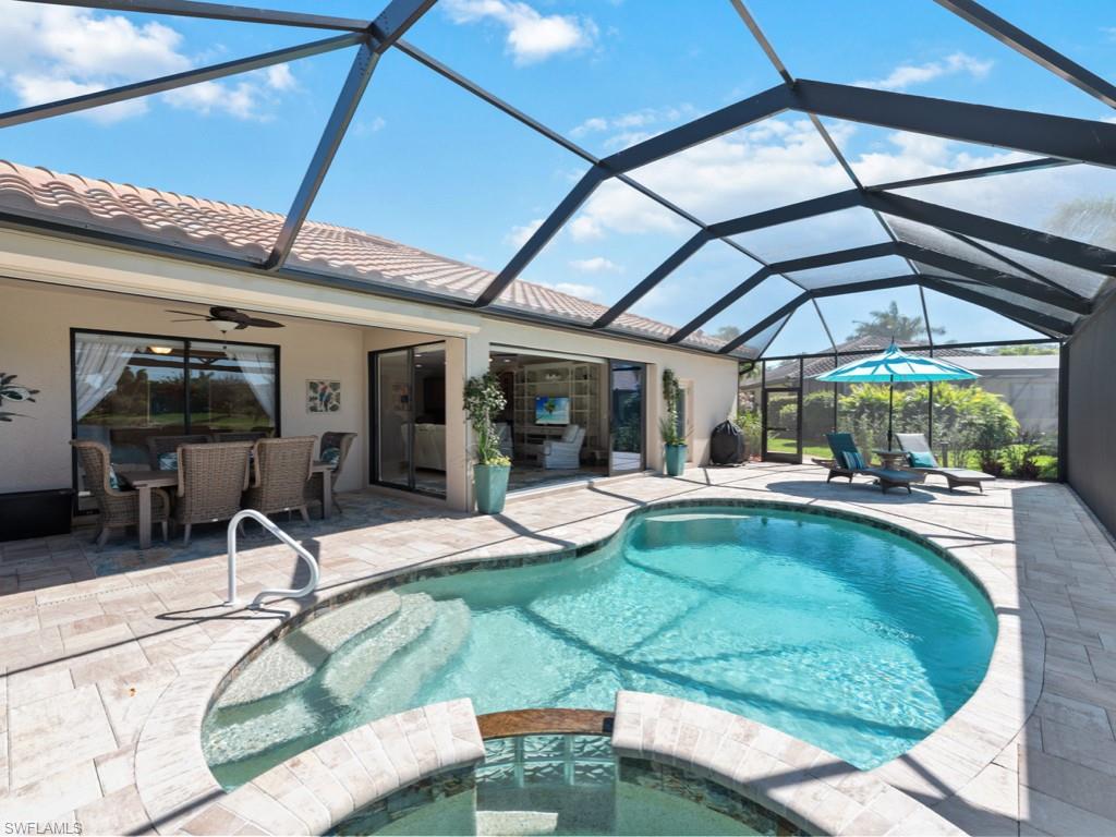 3913 Sapphire Way Naples, FL 34114 - Photo 32 of 32 a swimming pool with outdoor seating and yard