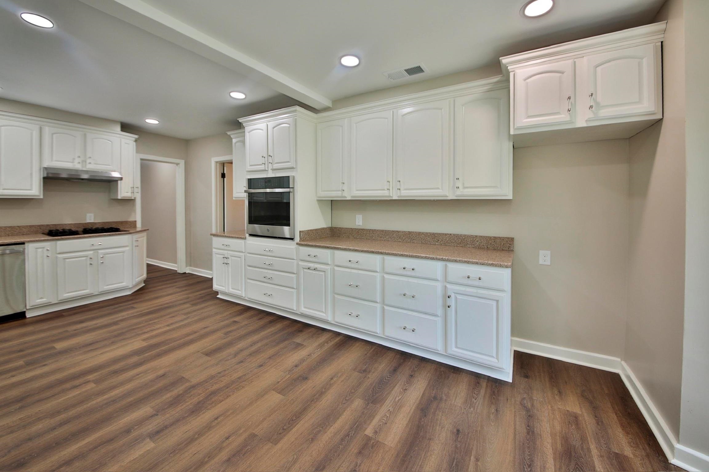 4869 Southern Road Memphis, TN 38117 - Photo 11 of 35 a kitchen with stainless steel appliances granite countertop a stove a sink and a microwave