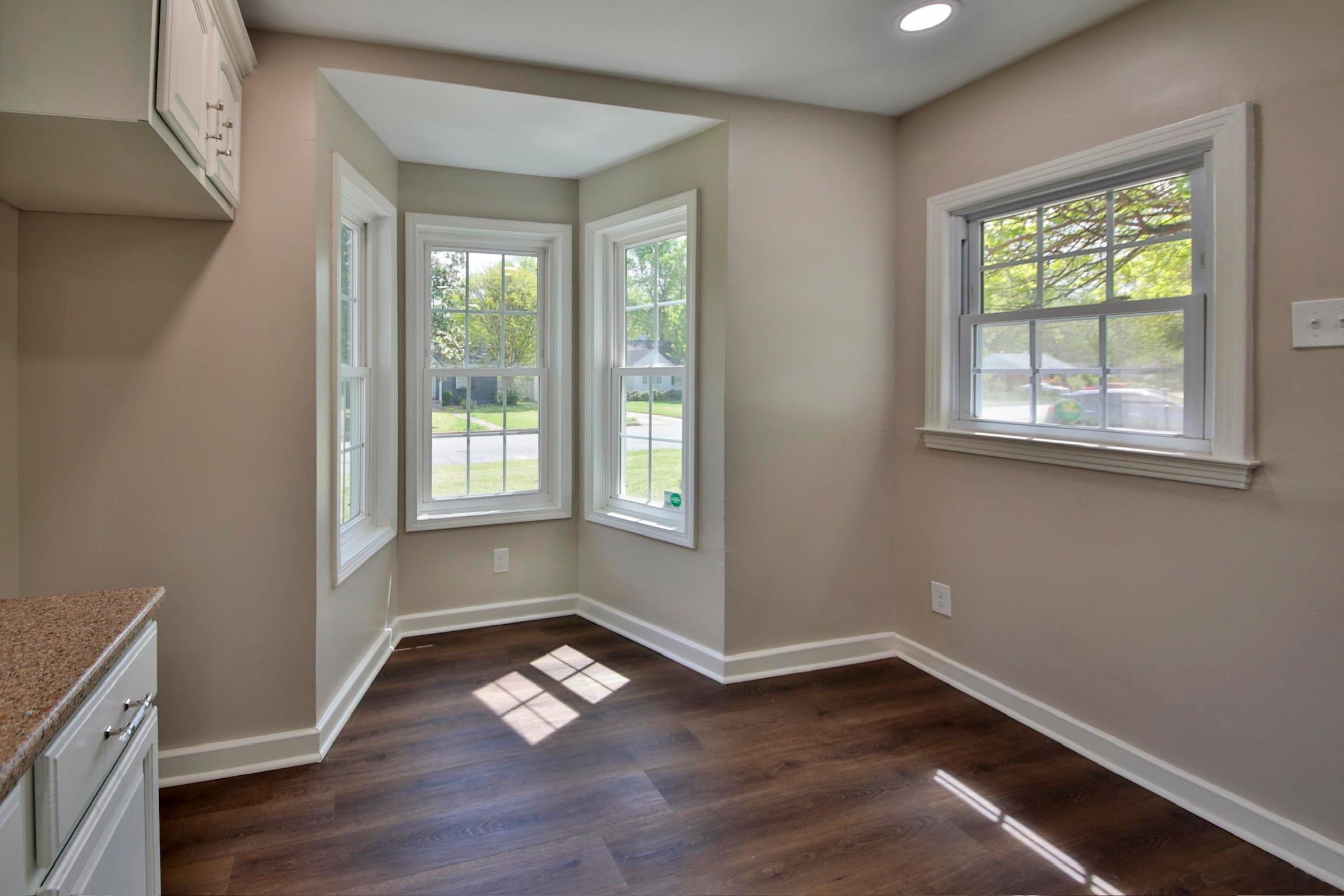 4869 Southern Road Memphis, TN 38117 - Photo 14 of 35 a view of an empty room with wooden floor and a window