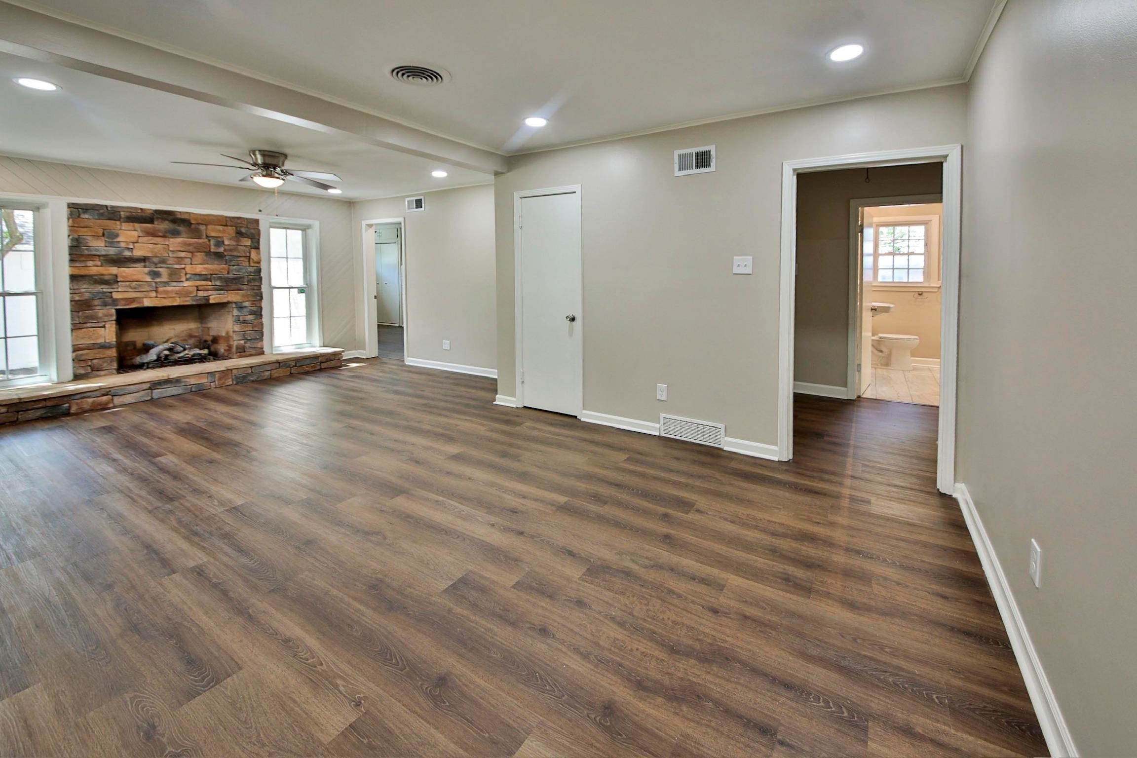 4869 Southern Road Memphis, TN 38117 - Photo 15 of 35 a view of an empty room with wooden floor and a fireplace