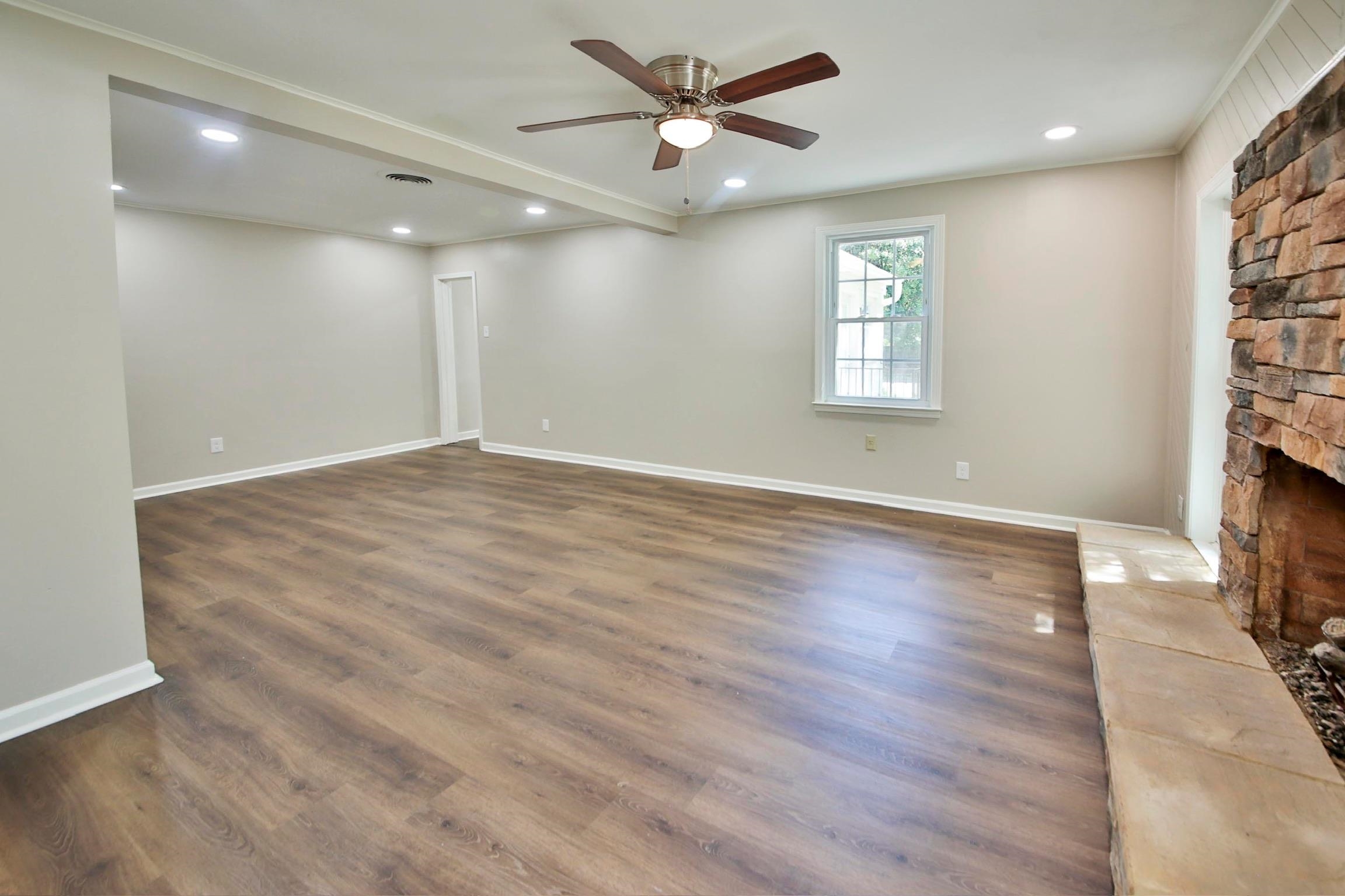 4869 Southern Road Memphis, TN 38117 - Photo 18 of 35 a view of an empty room with a window and wooden floor