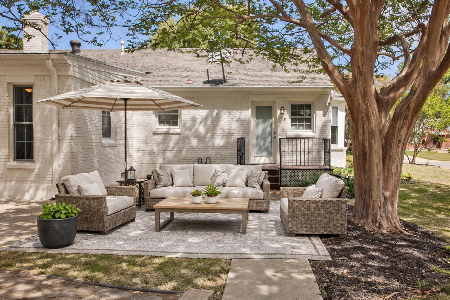 4869 Southern Road Memphis, TN 38117 - Photo 33 of 35 a view of a patio with couches table and chairs and potted plants