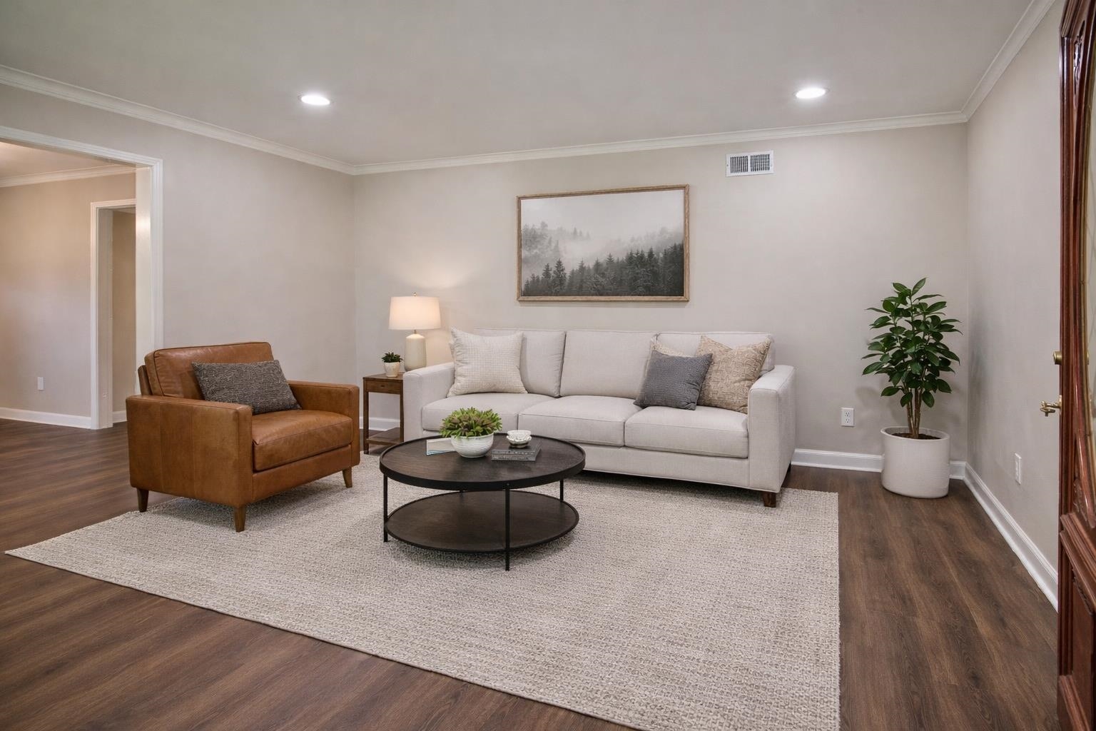 4869 Southern Road Memphis, TN 38117 - Photo 4 of 35 a living room with furniture and a potted plant