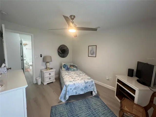 a bedroom with bed and window