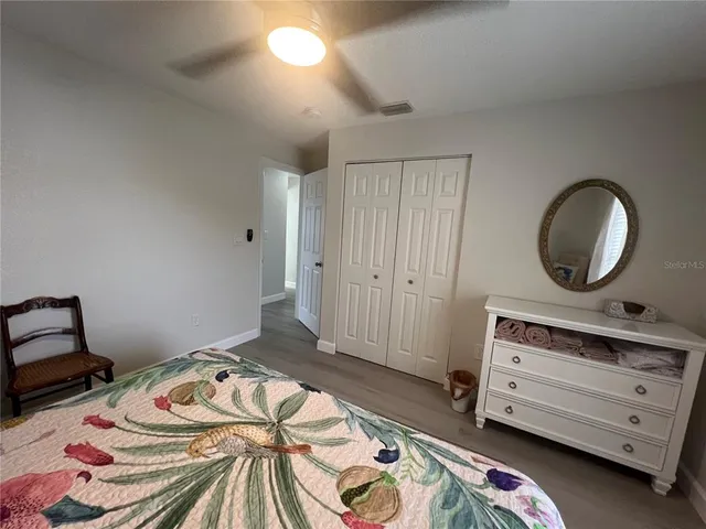 a bedroom with a bed and a dresser