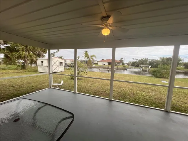 a view of a living room and floor to ceiling window