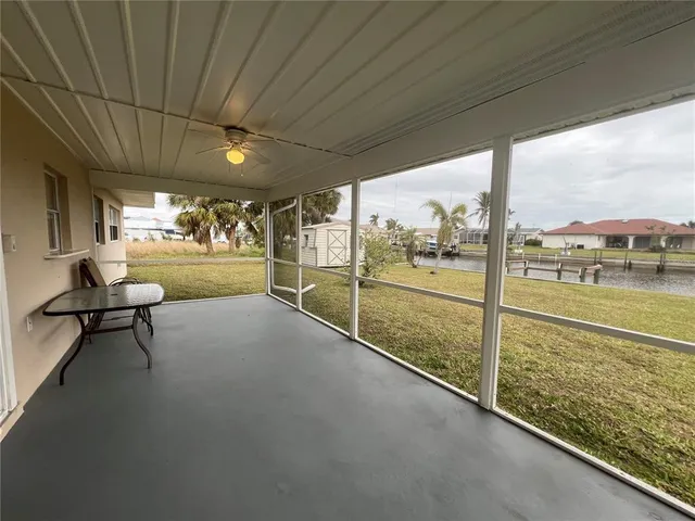 a view of a floor to ceiling window and an outdoor seating