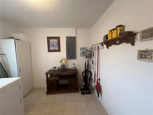 a bedroom with furniture and a gate