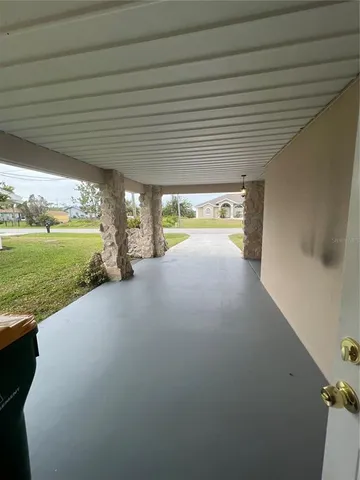 a view of an empty room with a ocean view