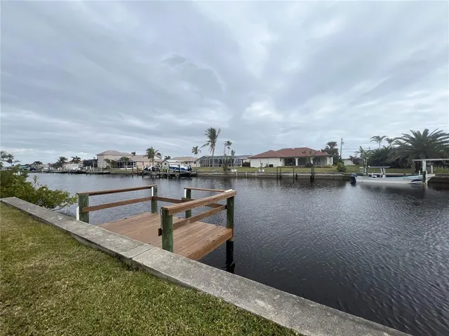a view of a lake with houses in the back