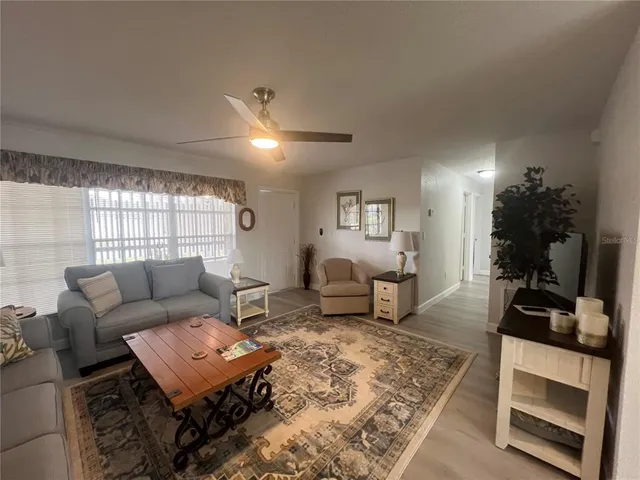a living room with furniture and a table