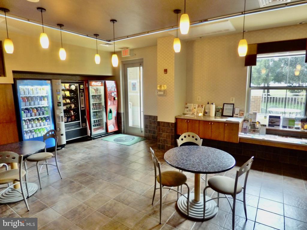 11800 Sunset Hills Road, Unit 118 Reston, VA 20190 - Photo 40 of 52 Cozy communal space with refreshments.
