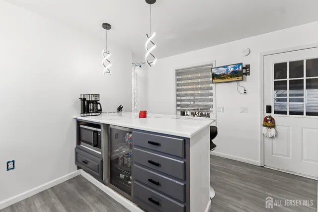 a utility room with closet dryer and washer