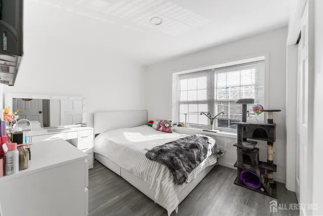 a bedroom with a bed and a table in it