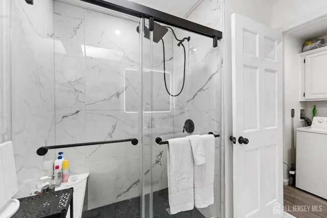 a bathroom with a shower and a shower