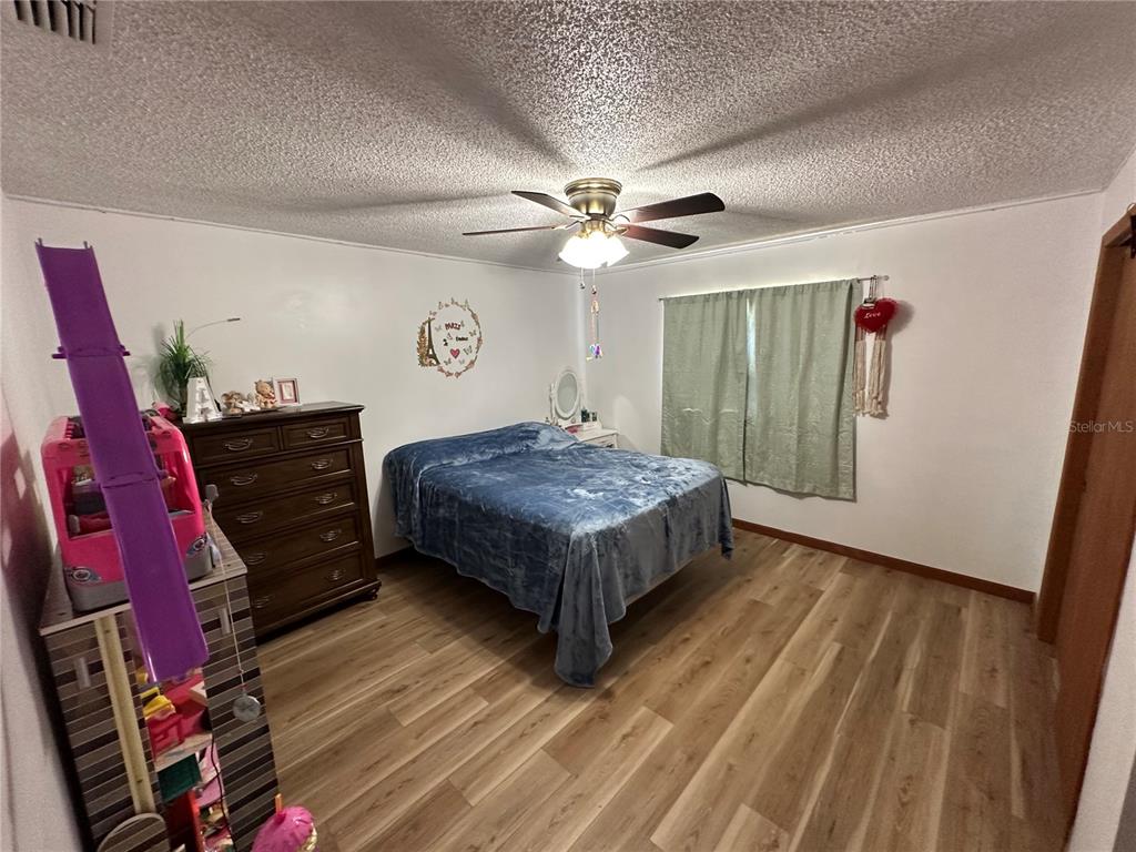 13220 225th Road Live Oak, FL 32060 - Photo 14 of 31 a living room with furniture and wooden floor
