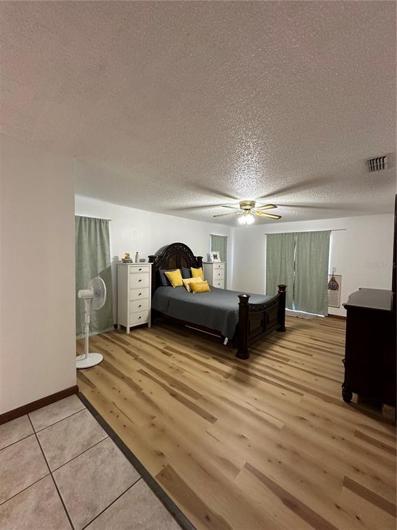 13220 225th Road Live Oak, FL 32060 - Photo 18 of 31 a living room with furniture a fireplace and a flat screen tv