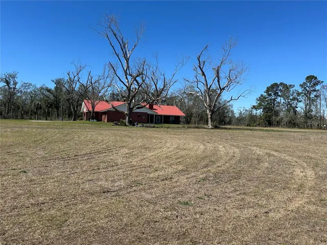 a backyard of a house with lots of green space
