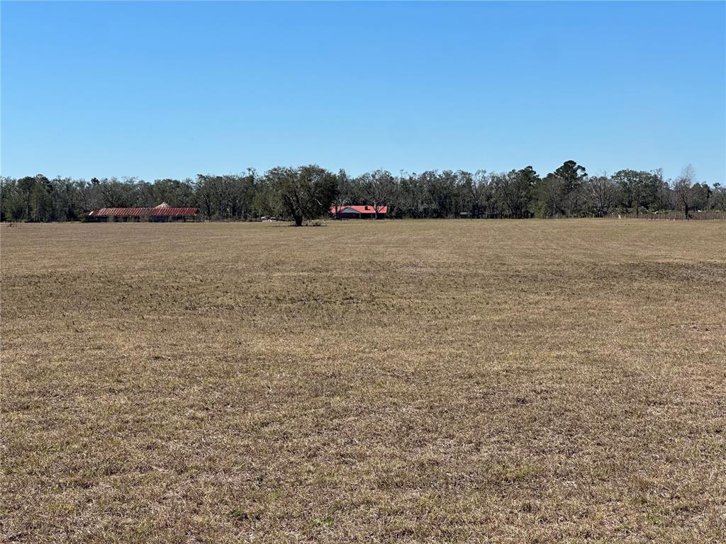 13220 225th Road Live Oak, FL 32060 - Photo 27 of 31 a view of lake with mountain in background