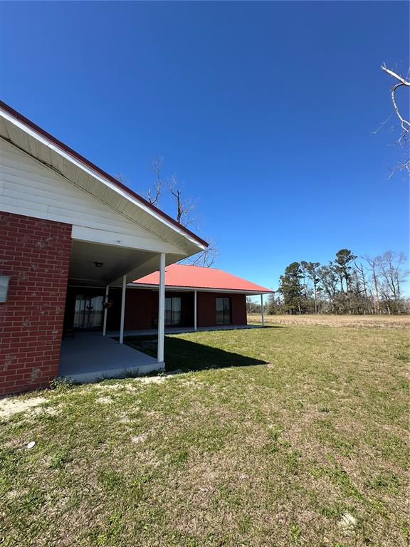 13220 225th Road Live Oak, FL 32060 - Photo 7 of 31 a view of a house with a yard