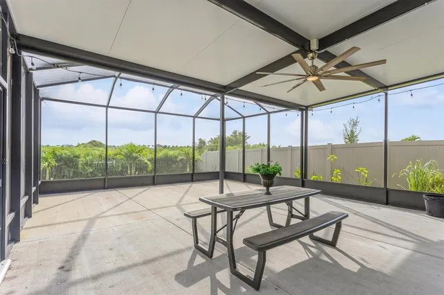 a bathroom with a granite countertop sink a mirror and a bathtub