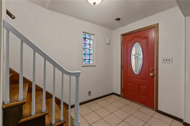 a view of an entryway with wooden floor