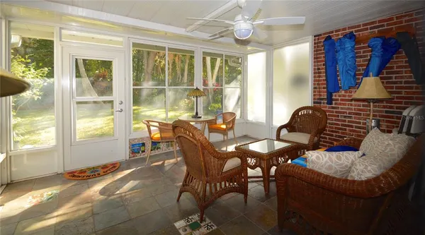 a outdoor dining space with furniture and window