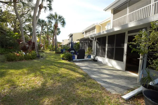 a view of a yard with a tree