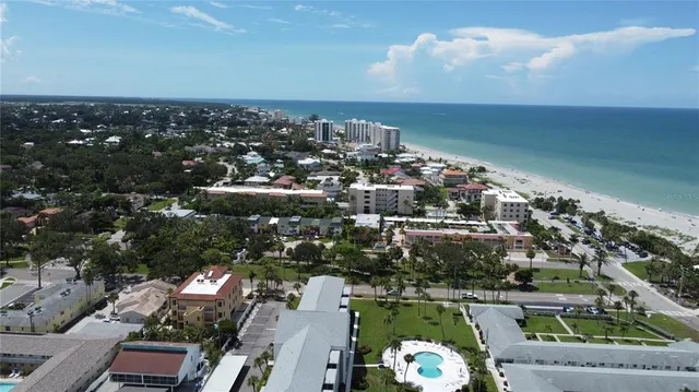 a view of a patio with chairs and plants