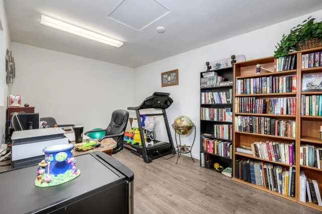 a living room with lots of books and toys