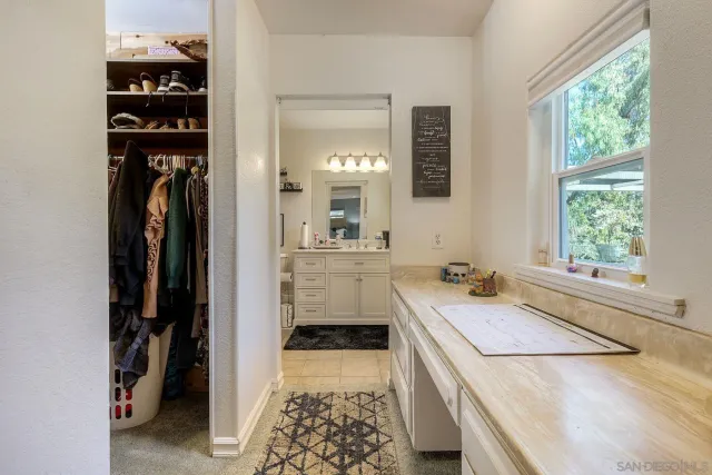 a bathroom with a sink a vanity and a mirror
