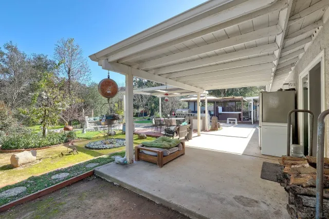 a view of swimming pool with seating area and furniture