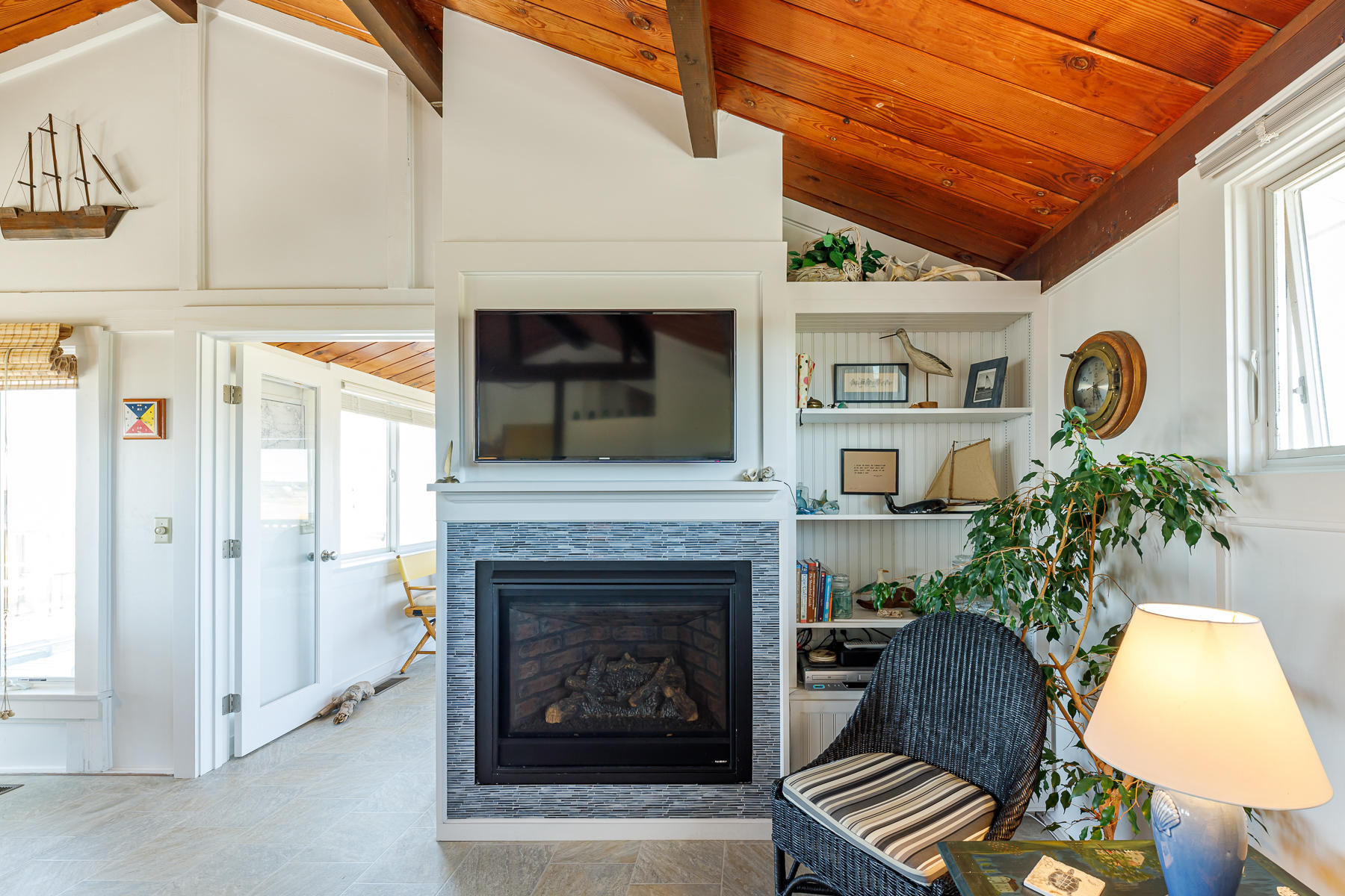 165 Harmes Way Eastham, MA 02642 - Photo 12 of 31 a living room with furniture and a fireplace