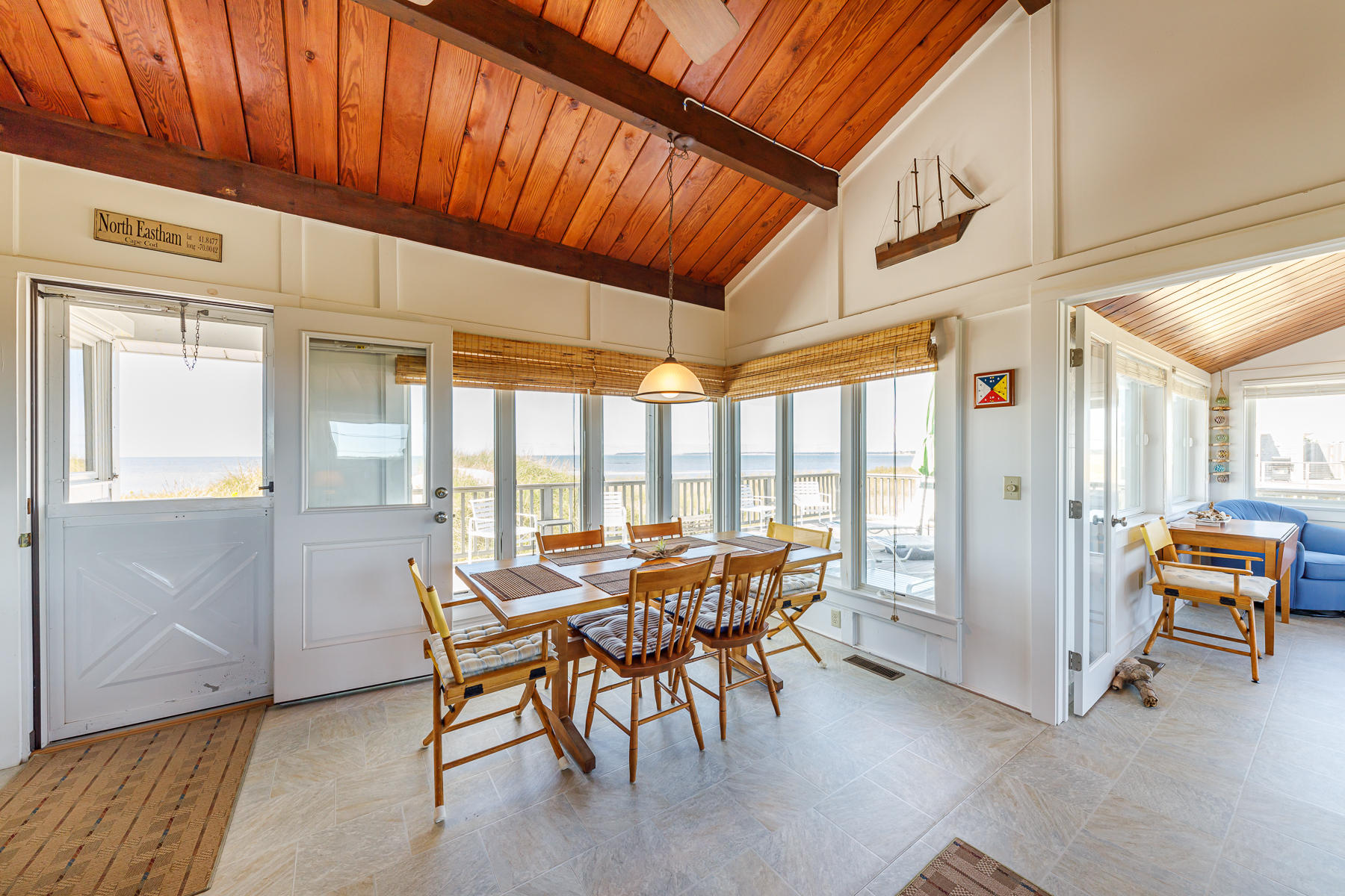 165 Harmes Way Eastham, MA 02642 - Photo 13 of 31 a view of a dining room with furniture window and outside view
